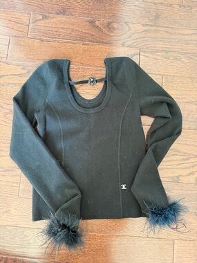 CHANEL Black Ribbed Knit Beanie with Feather Pom-Pom arm detail 
Size large